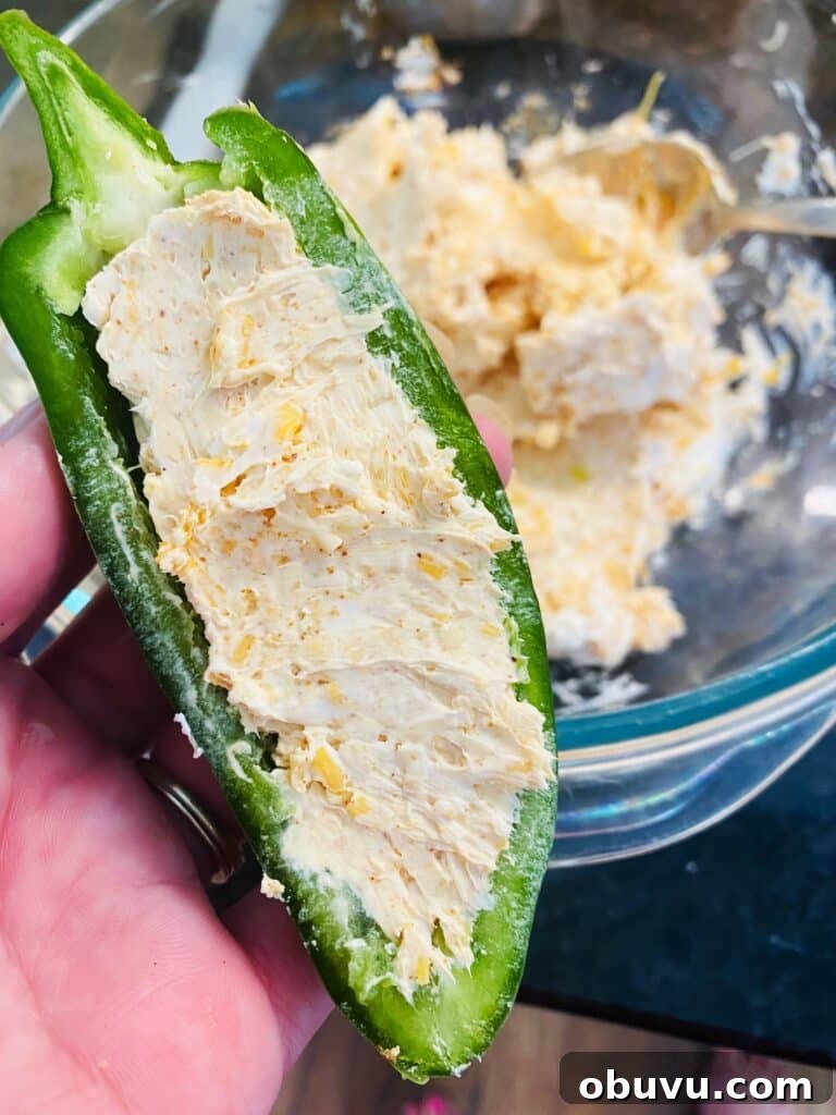Smoked Honey Jalapeño Poppers with Creamy Cheese Filling 5 stuffing the first jalapeno