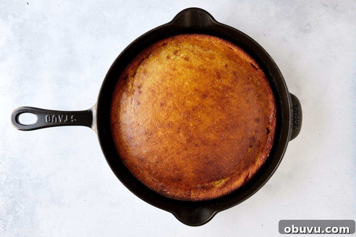 Brown Butter Cornbread with Whipped Honey Butter Spread 3 A cast iron skillet full of baked brown butter cornbread.