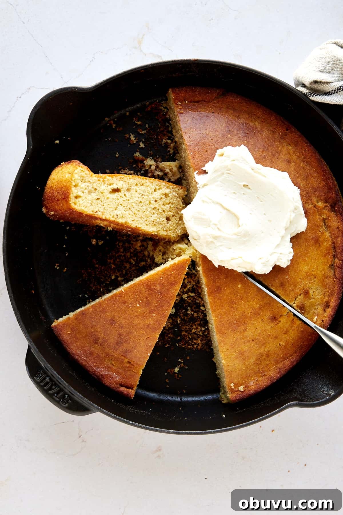 Brown Butter Cornbread with Whipped Honey Butter Spread 4 Half a skillet of brown butter cornbread topped with whipped butter and two pieces on the other side.