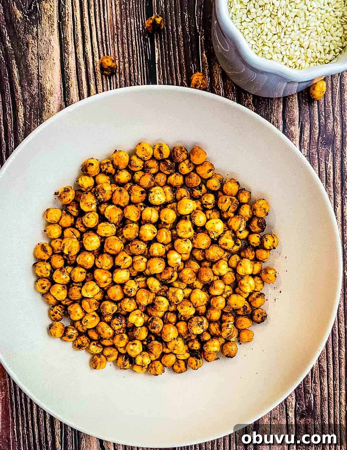 Crispy air fryer chickpeas on a white plate.