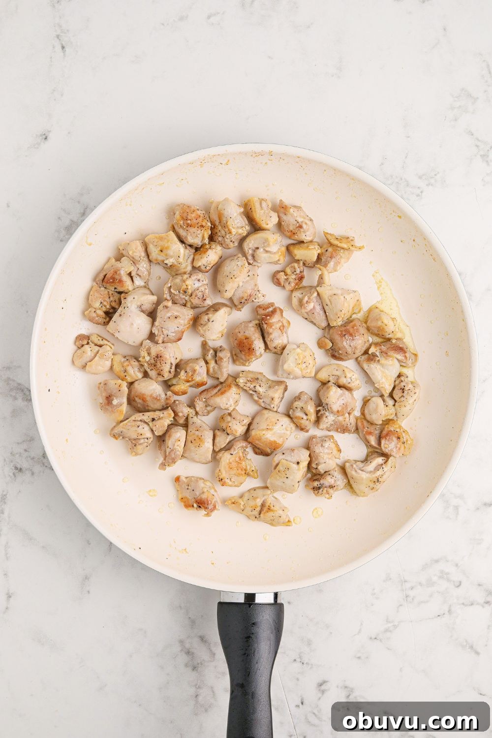 30-Minute Bourbon Chicken Skillet Recipe That Beats Takeout 8 skillet of diced chicken on a marble counter