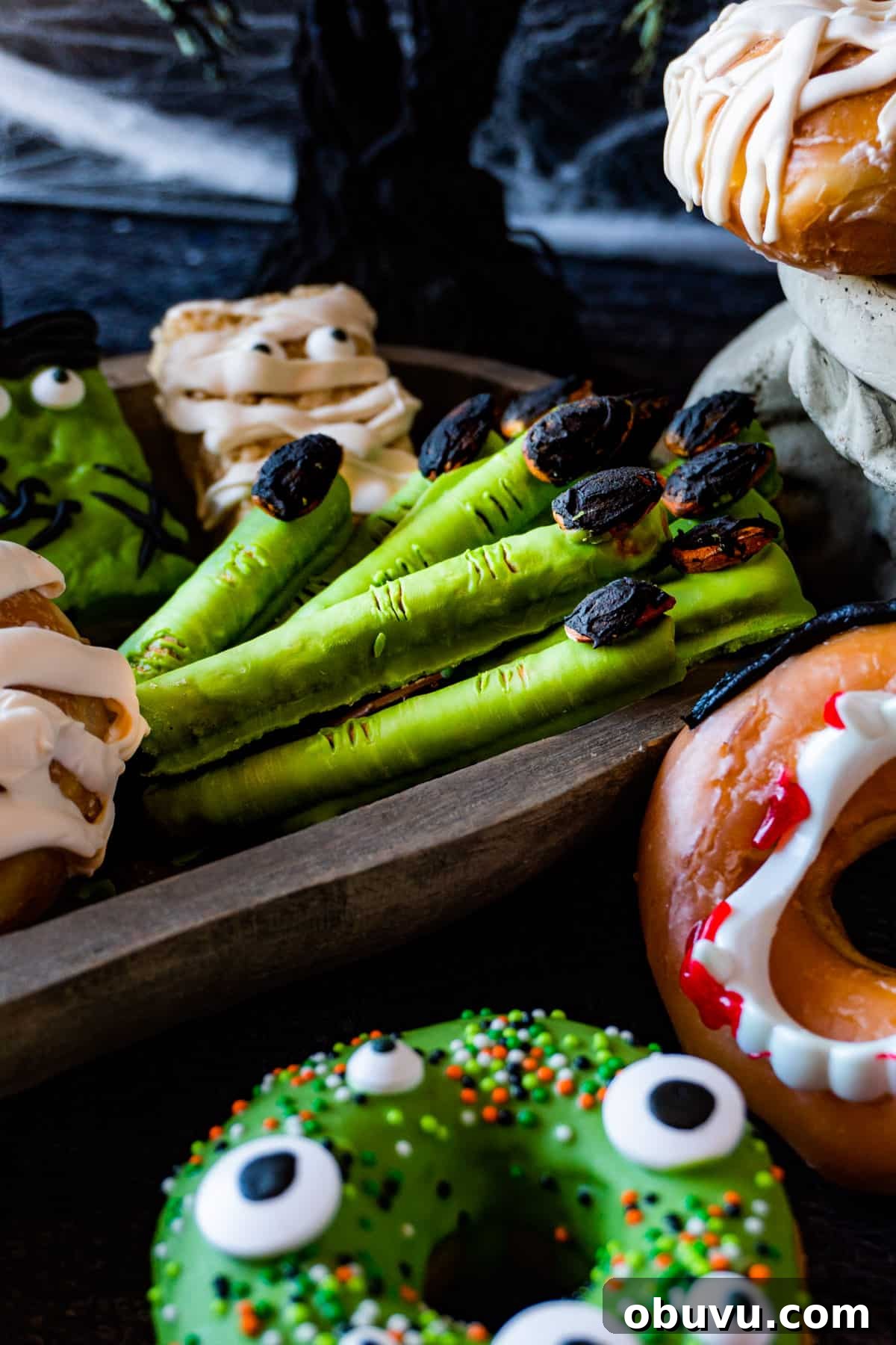 Witch Finger Cookies Recipe: Spooky Halloween Treats 10 witches fingers on a snack board with other halloween snacks.