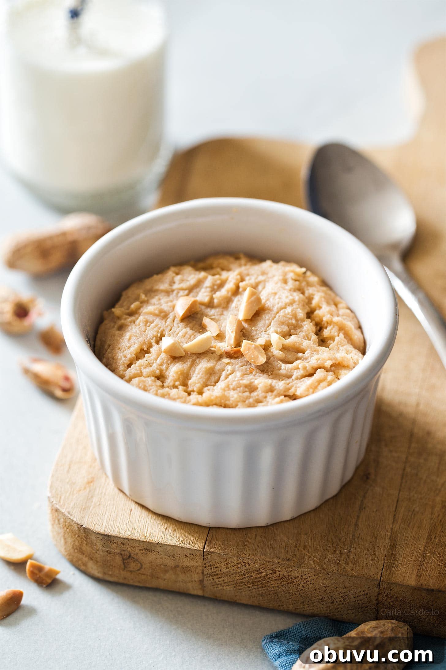 Quick Microwave Peanut Butter Cookie in 2 Minutes 2 Microwave peanut butter cookie in a white ramekin on a wooden cutting board