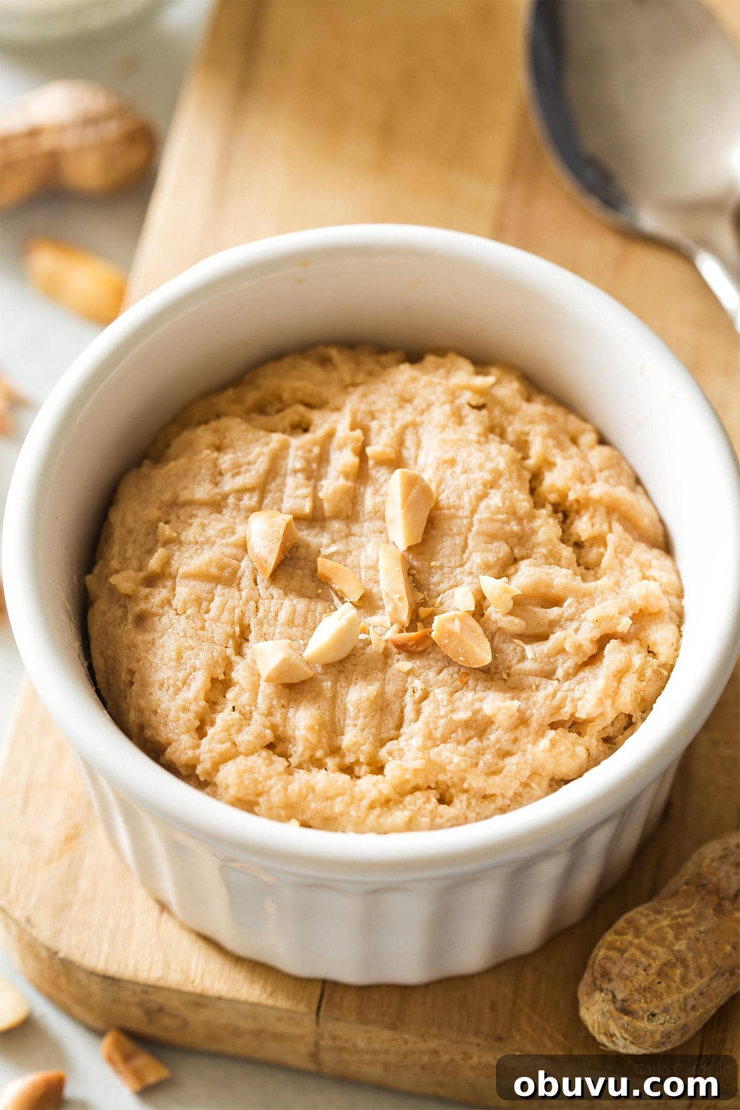 Quick Microwave Peanut Butter Cookie in 2 Minutes 3 Peanut Butter Mug Cookie on wooden cutting board