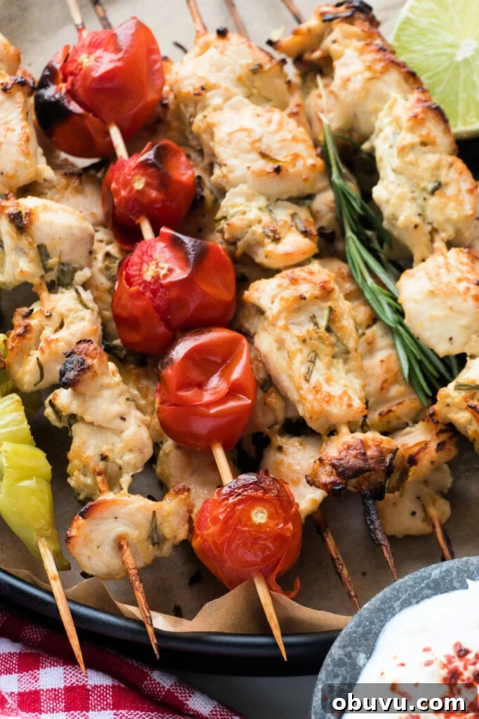 chicken skewers stacked on serving tray