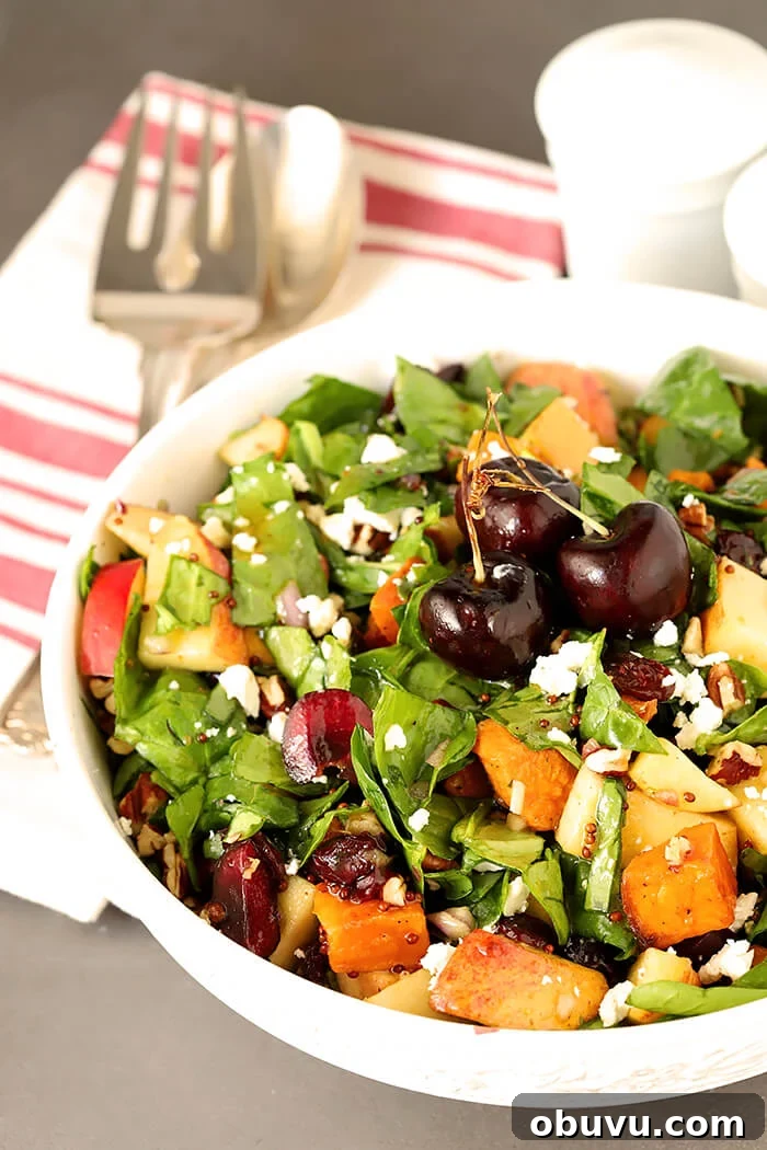 Roasted Sweet Potato & Spinach Chopped Salad with Maple Vinaigrette 2 Sweet Potato and Spinach Salad with Pecans, Cherries and Goat Cheese in a Round White Serving Bowl