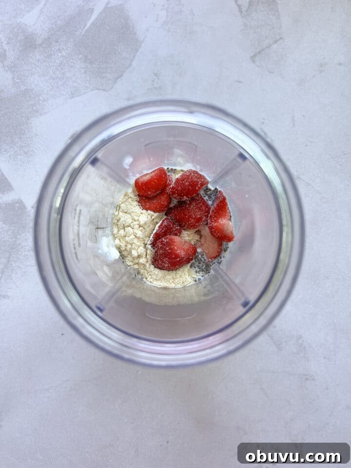 Blended Strawberry Cheesecake Chia Pudding Recipe 5 Ingredients for strawberry cheesecake chia pudding in a blender cup, unmixed