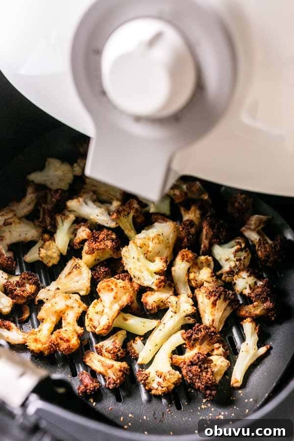 Crispy Air Fryer Frozen Cauliflower in 15 Minutes 2 This Air Fryer frozen cauliflower recipe turns into the most delicious roasted cauliflower. A great side dish that is on the table in no time. No mushy smells while cooking. Season with your favorite seasoning. A new family favorite.
