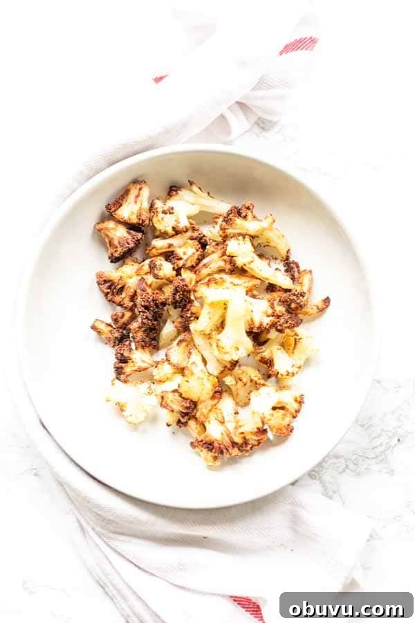Crispy Air Fryer Frozen Cauliflower in 15 Minutes 5 This Air Fryer frozen cauliflower recipe turns into the most delicious roasted cauliflower. A great side dish that is on the table in no time. No mushy smells while cooking. Season with your favorite seasoning. A new family favorite.