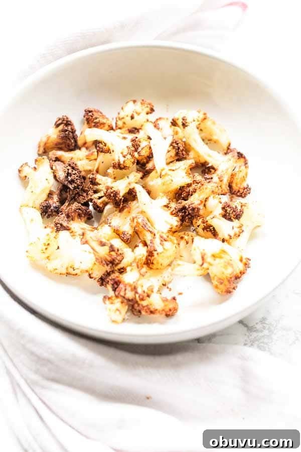 Crispy Air Fryer Frozen Cauliflower in 15 Minutes 7 This Air Fryer frozen cauliflower recipe turns into the most delicious roasted cauliflower. A great side dish that is on the table in no time. No mushy smells while cooking. Season with your favorite seasoning. A new family favorite.