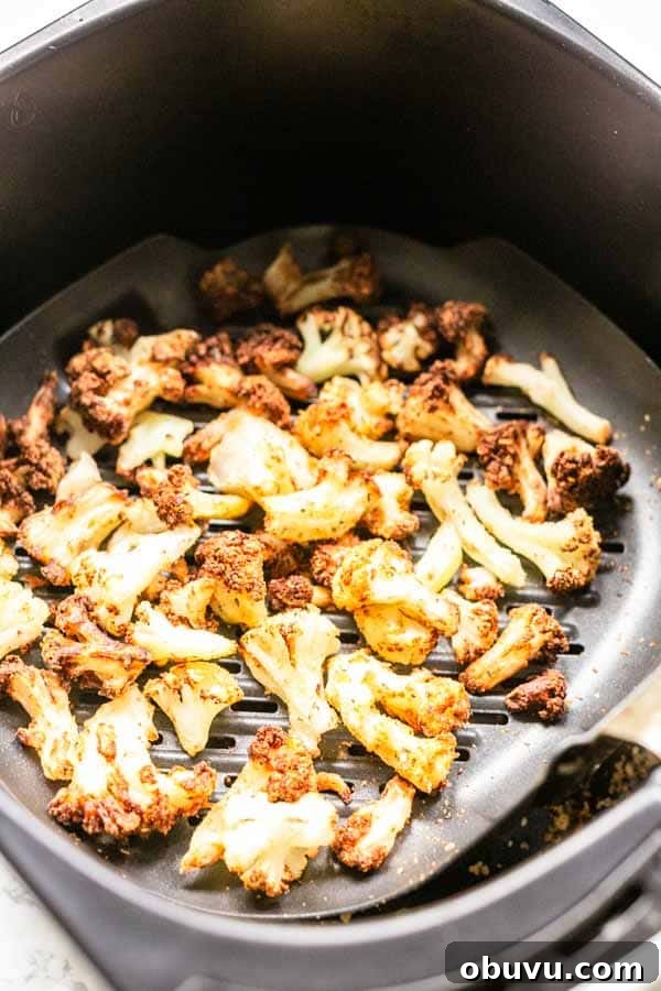 Crispy Air Fryer Frozen Cauliflower in 15 Minutes 8 This Air Fryer frozen cauliflower recipe turns into the most delicious roasted cauliflower. A great side dish that is on the table in no time. No mushy smells while cooking. Season with your favorite seasoning. A new family favorite.