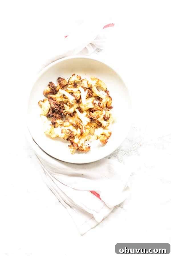 Crispy Air Fryer Frozen Cauliflower in 15 Minutes 9 This Air Fryer frozen cauliflower recipe turns into the most delicious roasted cauliflower. A great side dish that is on the table in no time. No mushy smells while cooking. Season with your favorite seasoning. A new family favorite.