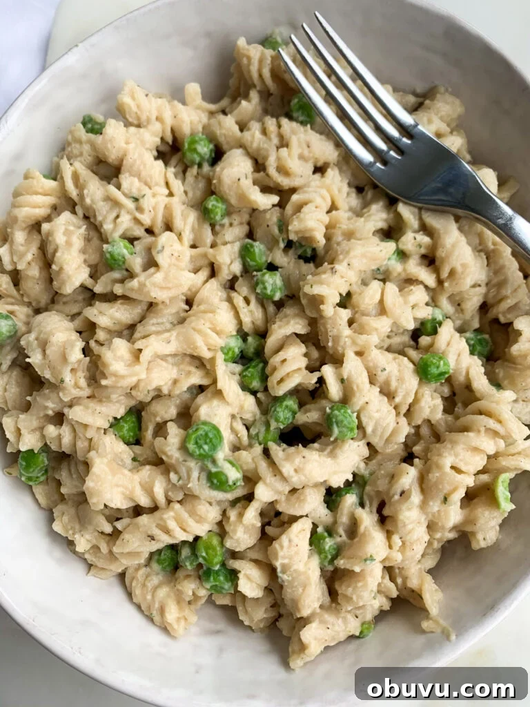 Creamy Cauliflower Pasta: Velvety Sauce & Garlic Parmesan Recipe 3 a white bowl of creamy cauliflower pasta