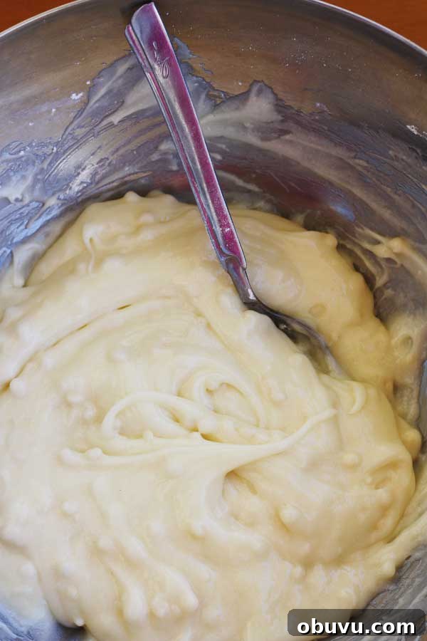 Banana Pistachio Cake with White Chocolate Cream Cheese Frosting 8 closeup of the white chocolate cream cheese frosting for a banana pistachio loaf