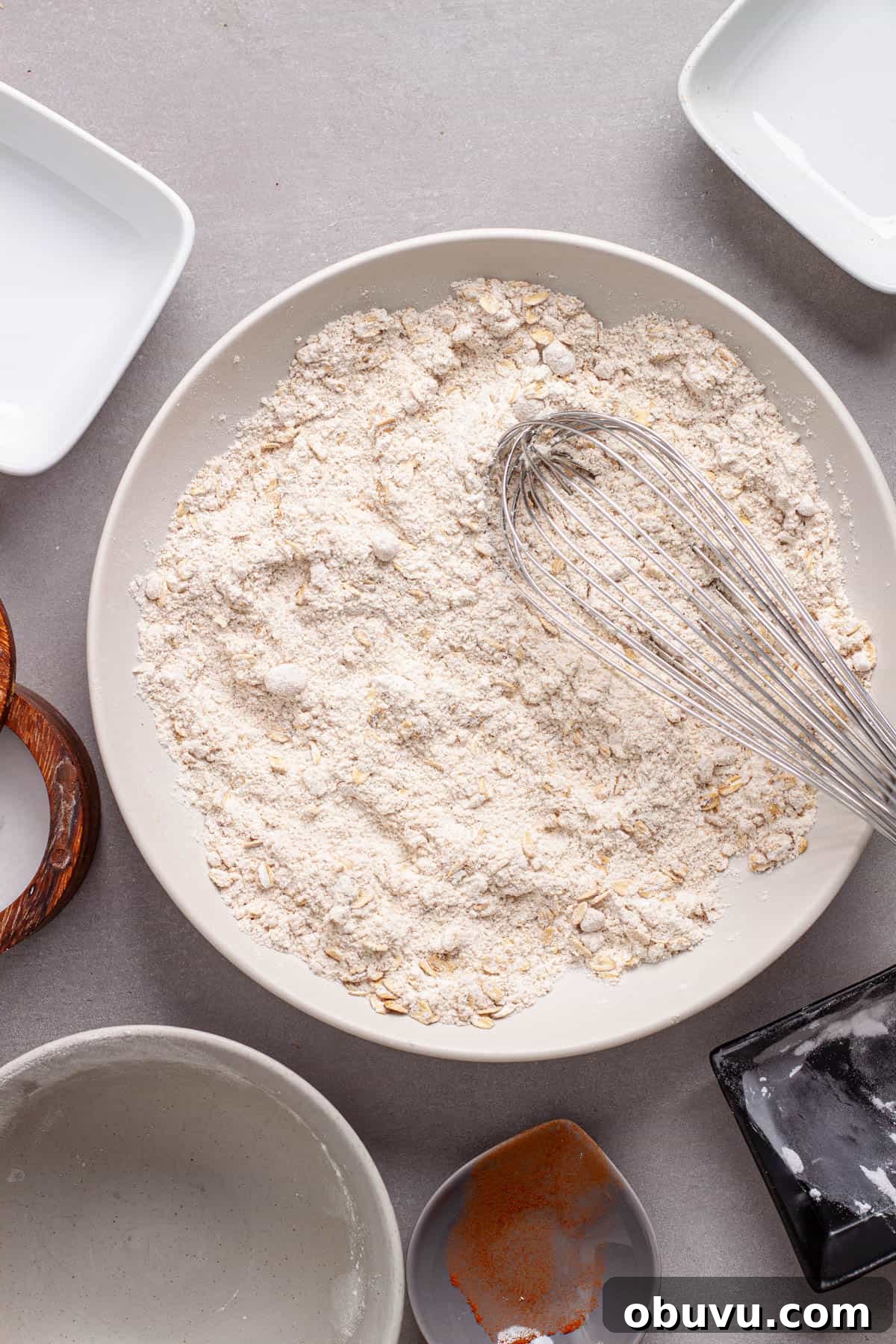 Dry ingredients for muffins whisked together in a medium bowl.