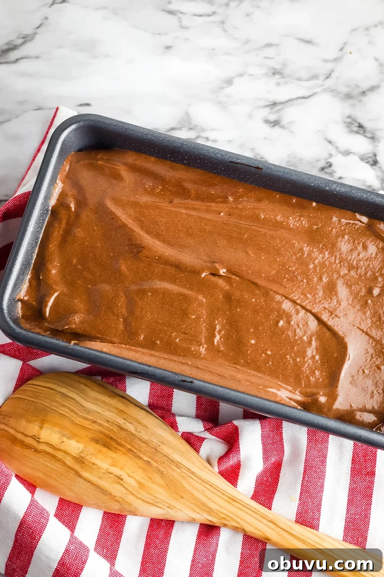 Chocolate Peppermint Pound Cake Recipe — Festive Holiday Dessert 9 Chocolate batter poured in bread pan for baking