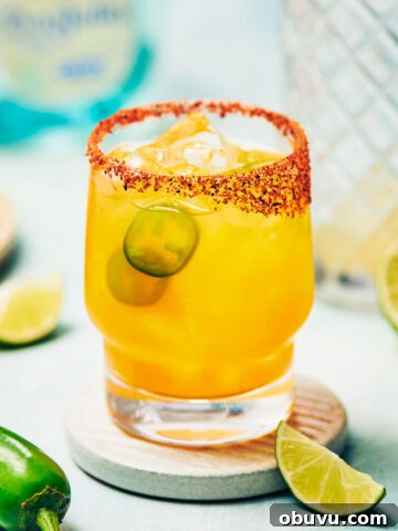 Spicy Mango Margarita with jalapeno peppers.