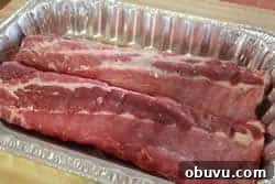 Sticky Smoked Ribs with Savory BBQ Sauce 2 Place baby back ribs in a foil pan