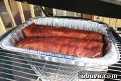 Sticky Smoked Ribs with Savory BBQ Sauce 6 Place pan of ribs on smoker grate