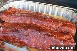 Sticky Smoked Ribs with Savory BBQ Sauce 8 Paint sauce onto ribs