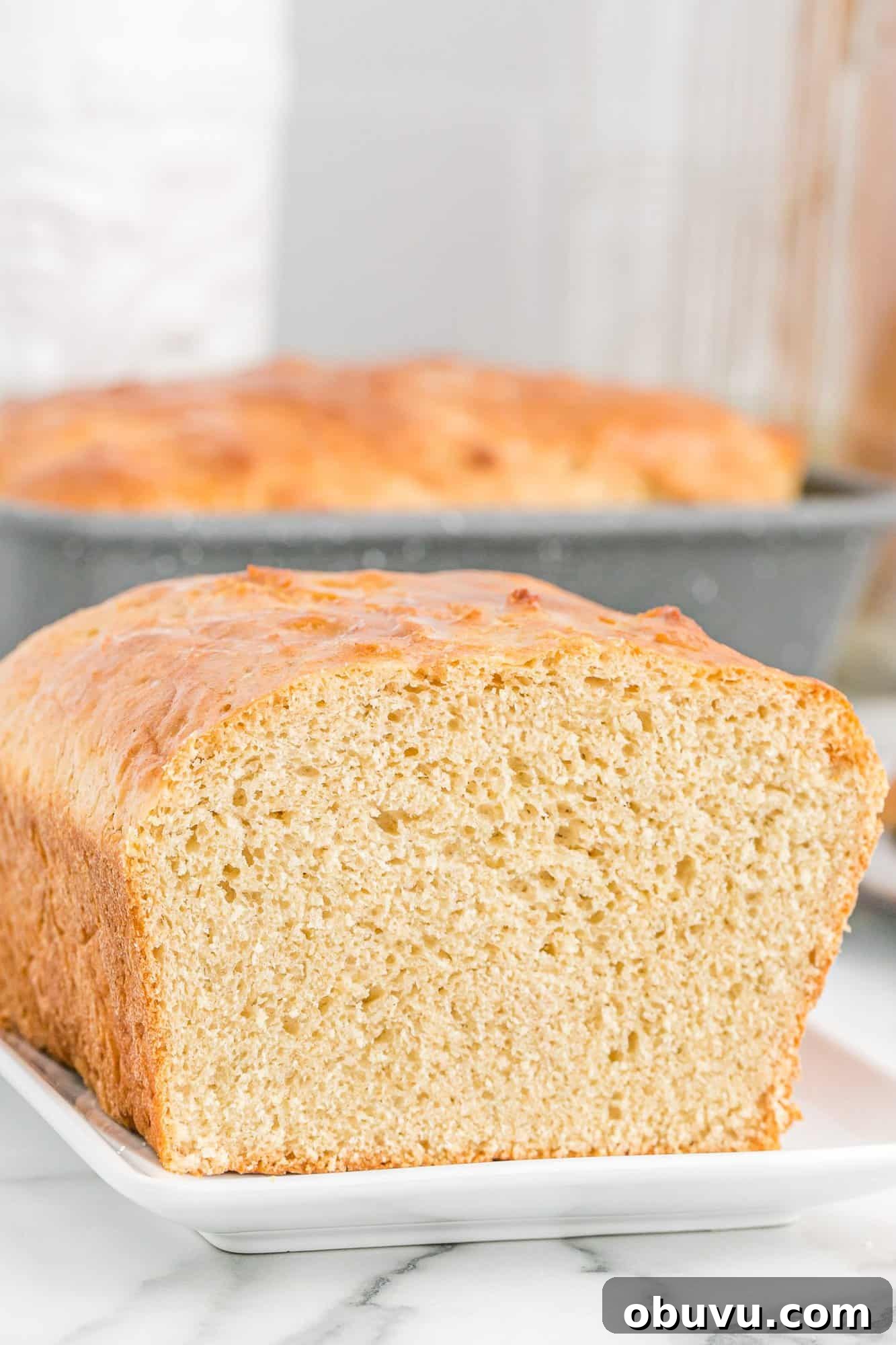 Close up view of loaf of bread with end sliced off.