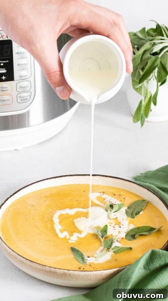 Creamy Instant Pot Butternut Squash Soup Recipe for Fall 5 heavy cream pouring into butternut squash soup