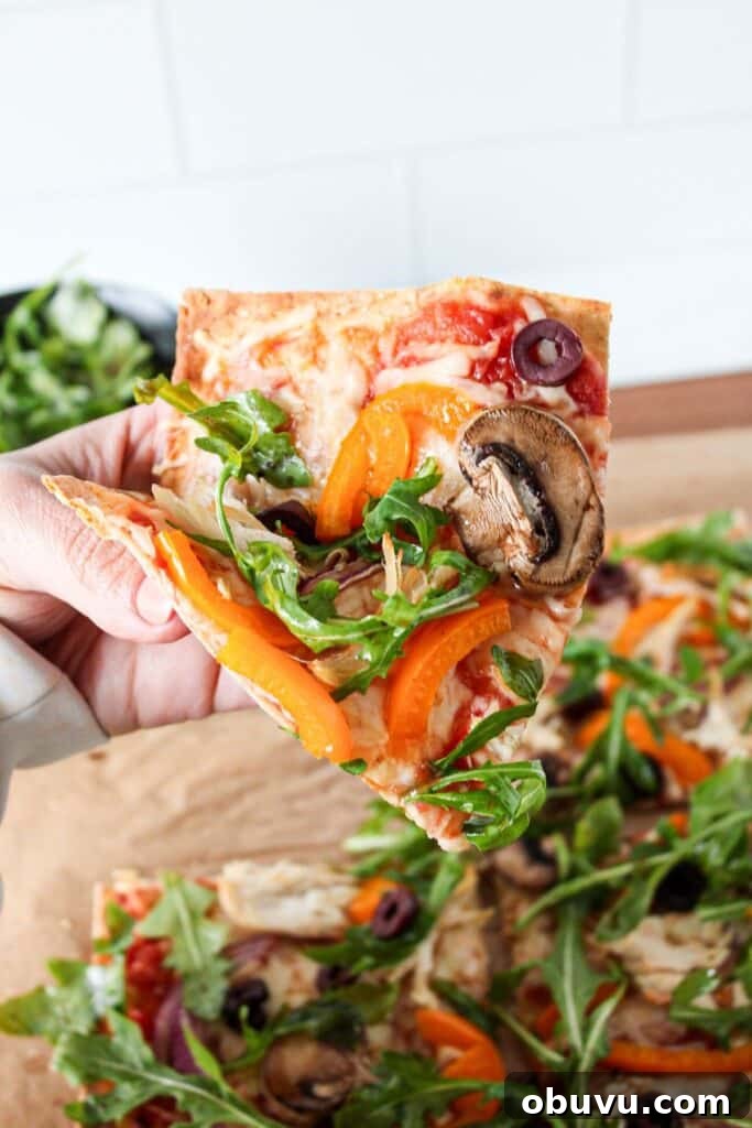 High-Protein Lavash Pizza Ready in 10 Minutes 9 A close up of a slice of lavash bread pizza.