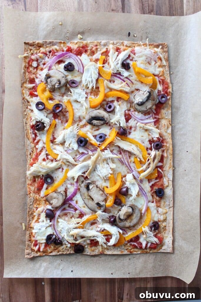 High-Protein Lavash Pizza Ready in 10 Minutes 7 A lavash bread pizza baked and on a piece of parchment paper