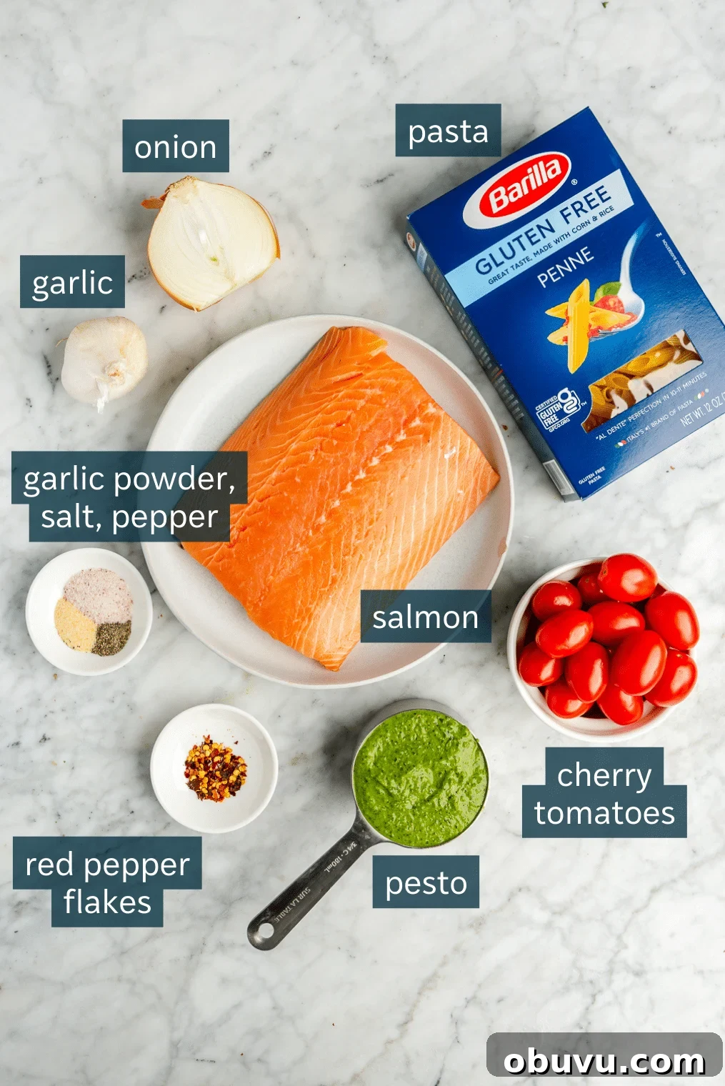 Salmon Pesto Pasta Recipe: Creamy 20-Minute Meal 3 All of the ingredients for salmon pesto pasta on a marble surface.
