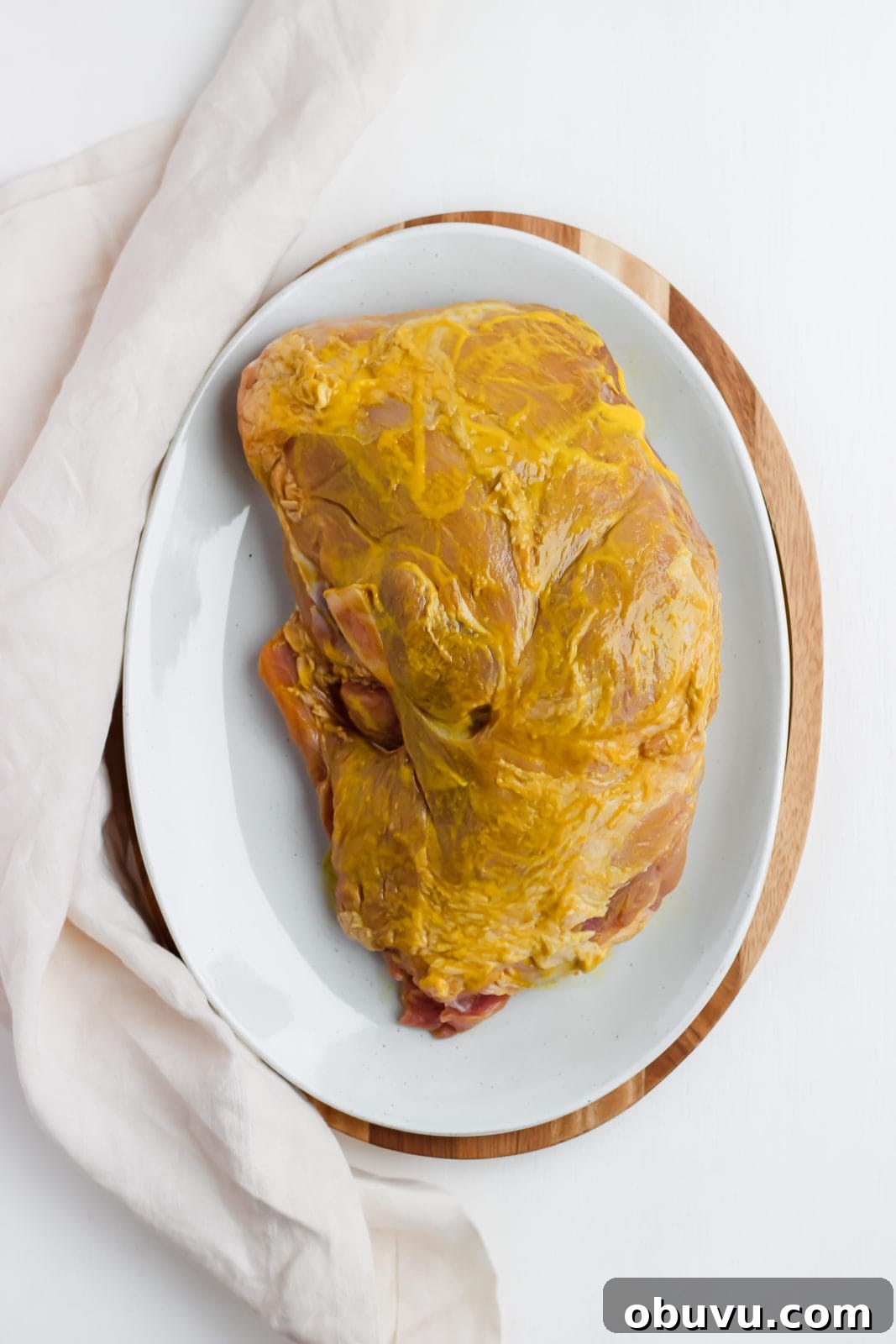 Tender Sous Vide Pork Shoulder Recipe for Juicy, Fall-Apart Meat 4 Pork shoulder rubbed in yellow mustard.
