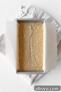 Moist Banana Bread Without Gluten — Simple Recipe for Tasty Loaf 8 Banana bread batter in a loaf tin on a folded linen napkin.
