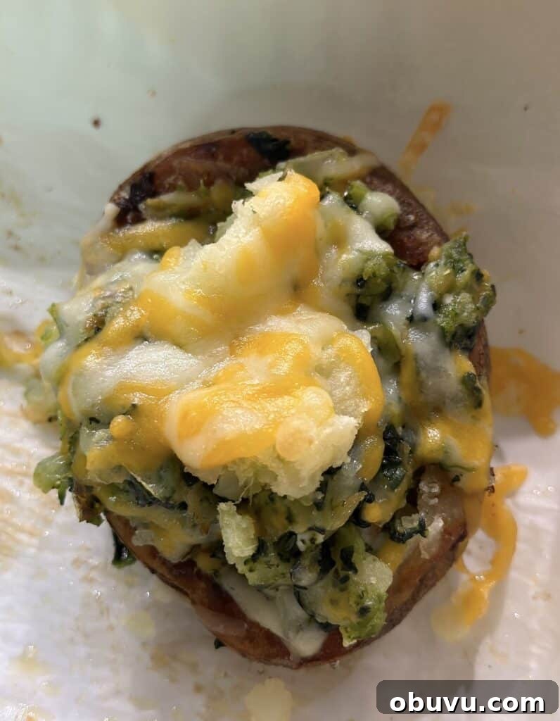 Twice-Baked Potato Stuffed with Broccoli, Spinach & Cheese 2 close up of stuffed twice-baked potato