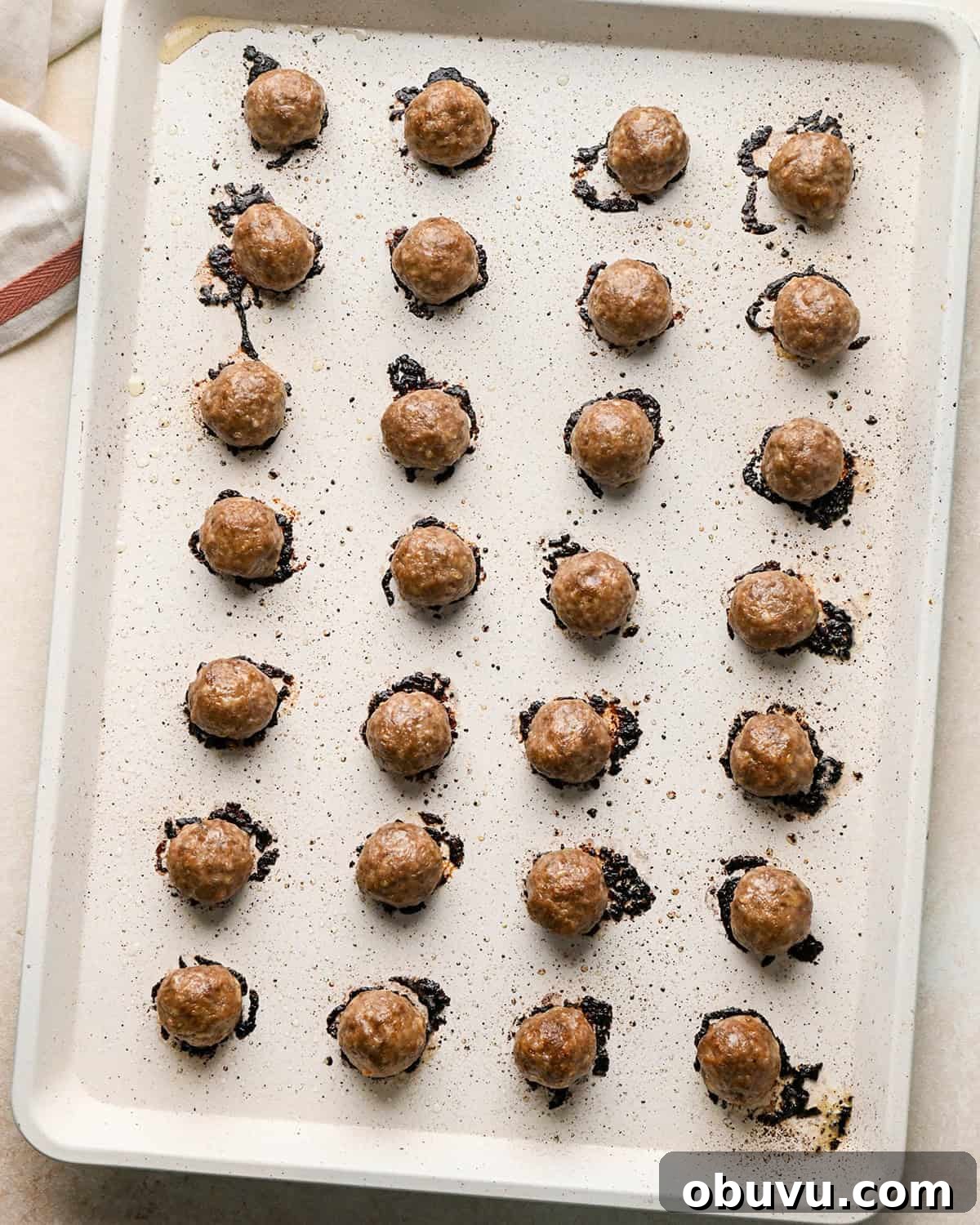 Gluten-Free Italian Meatballs Recipe – Tender & Flavorful 14 28 gluten free meatballs on a baking sheet after baking