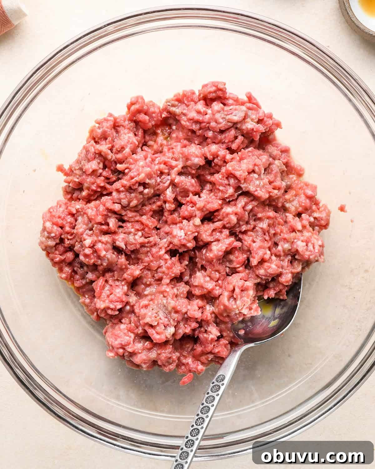 Gluten-Free Italian Meatballs Recipe – Tender & Flavorful 8 how to make Gluten Free Meatballs - ground beef, egg and milk in a bowl after mixing