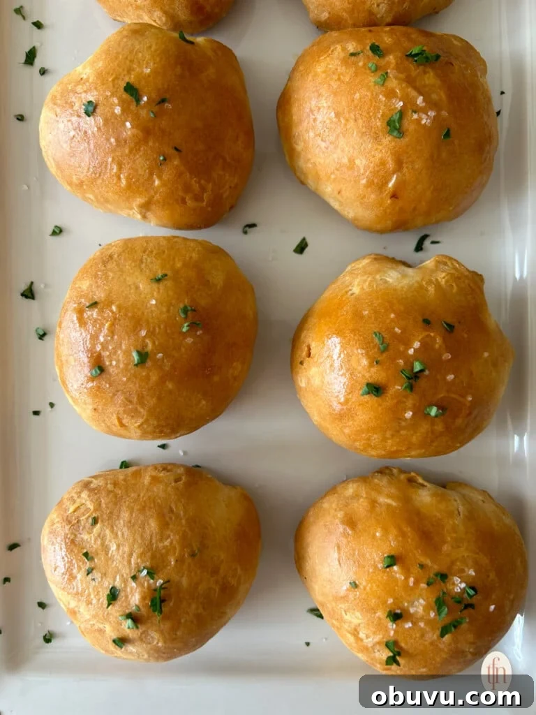 A plate of buffalo chicken bombs topped with parsley.