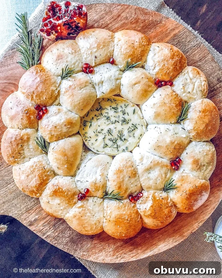 bread rolls in a circle around camembert cheese as a Christmas wreath.