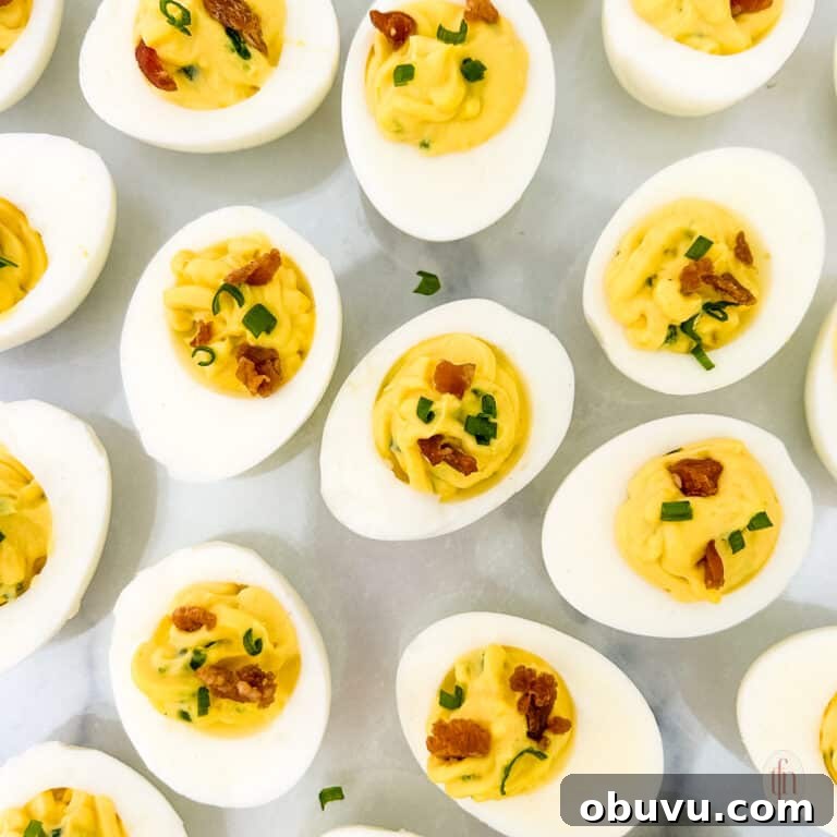 Spicy deviled eggs with garnish.