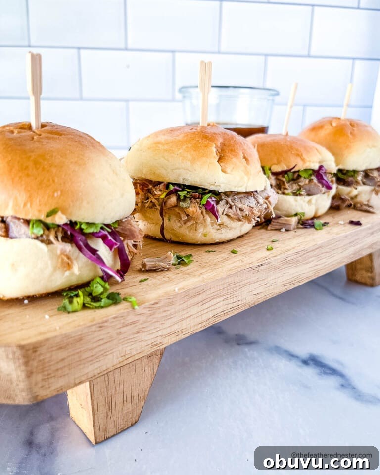 Dutch oven pulled pork sliders, topped with slaw and ready for serving.