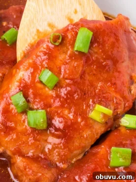 Tender Slow Cooker BBQ Pork Chops | Juicy, Hands-Off Recipe 7 close-up of slow cooker bbq pork chops.