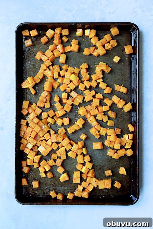Photo of roasted butternut squash on baking sheet.