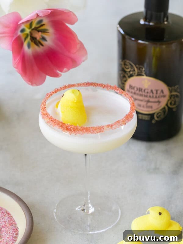 Bubble Gum Cocktail Recipe Using Infused Vodka 7 Peep cocktail with a sugared rim and yellow Peep floating on the top.