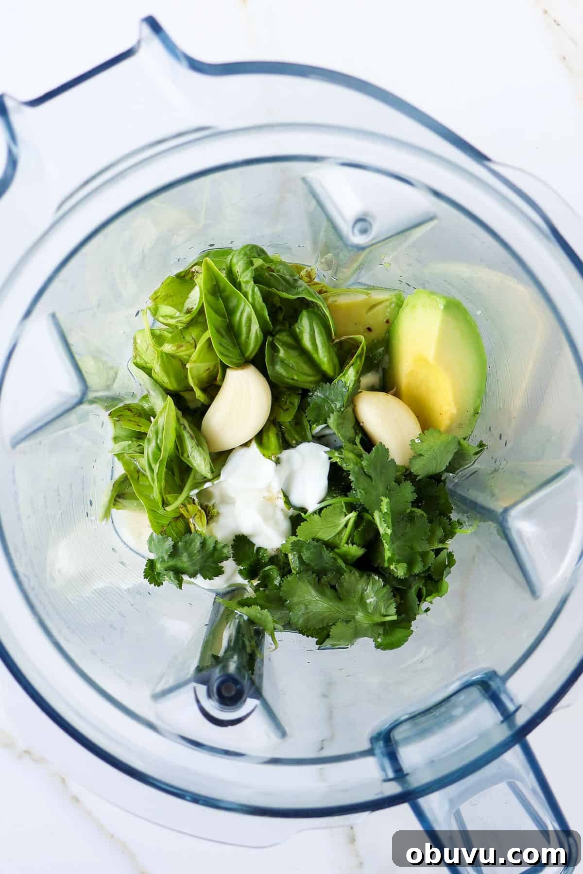 Creamy Avocado Green Goddess Dressing Recipe 5 Ingredients in a blender.
