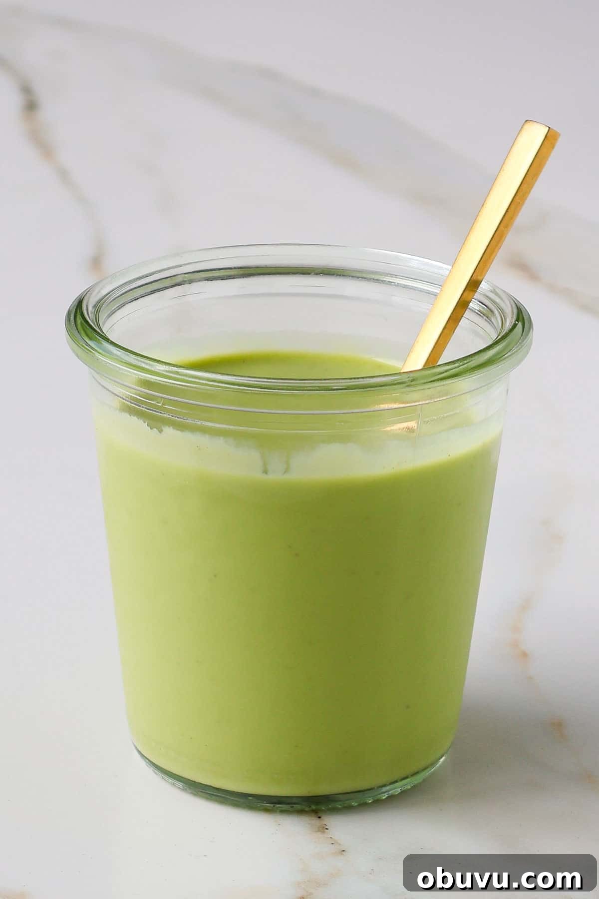 Creamy Avocado Green Goddess Dressing Recipe 8 Side shot of dressing in a jar.