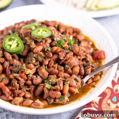 Authentic Charro Beans Recipe (Ranchero Beans) 13 Charro beans in a big white bowl.