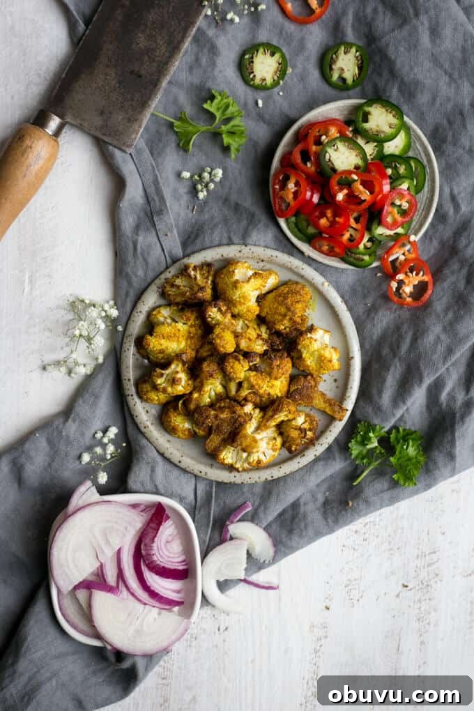 Naan bread pizza topped with roasted cauliflower and chillies | via @annabanana.co