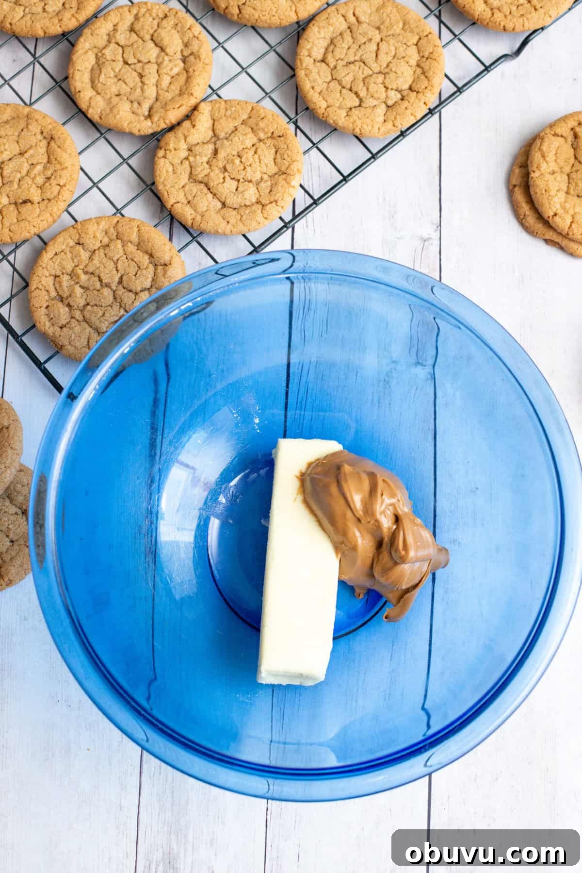 Cookie Butter Sandwich Cookies — Crunchy Fillings & Simple Recipe 11 butter and cookie butter in a mixing bowl