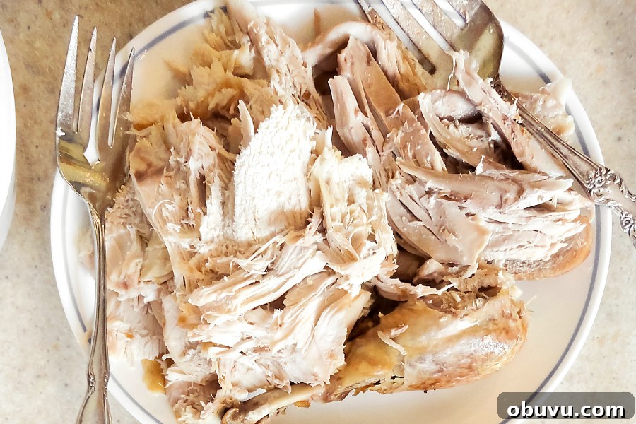 Leftover Turkey Pot Pie Recipe for Comforting Holiday Meals 3 shredded leftover turkey in white dish