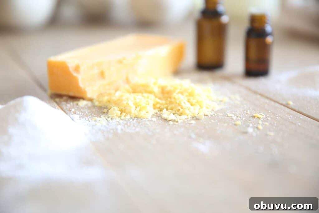 Make Your Own Laundry Soap: Simple DIY Recipe for Clean Clothes 3 Shredded soap bar and essential oil bottles.