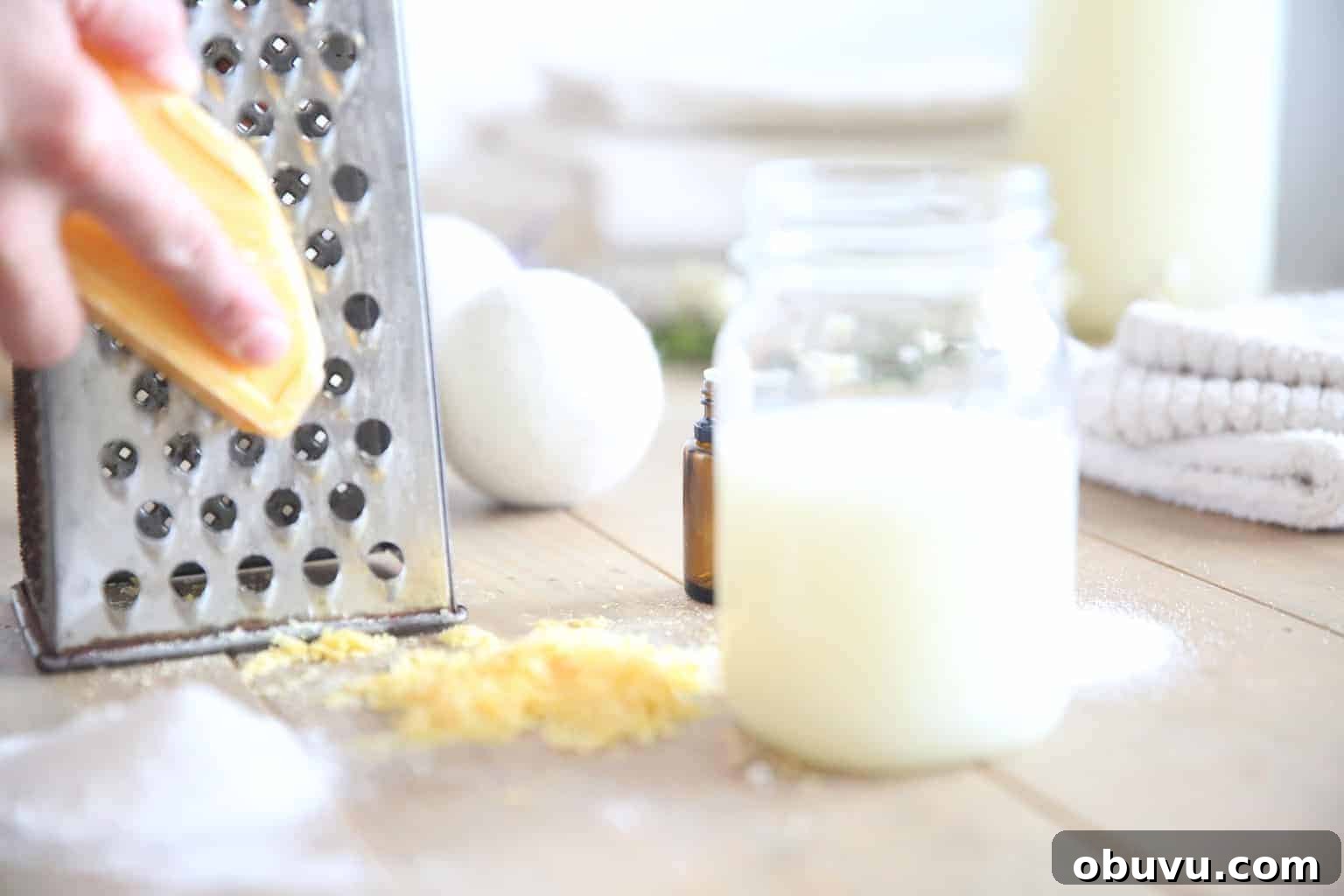 Make Your Own Laundry Soap: Simple DIY Recipe for Clean Clothes 4 Shredding a soap bar to make laundry detergent.
