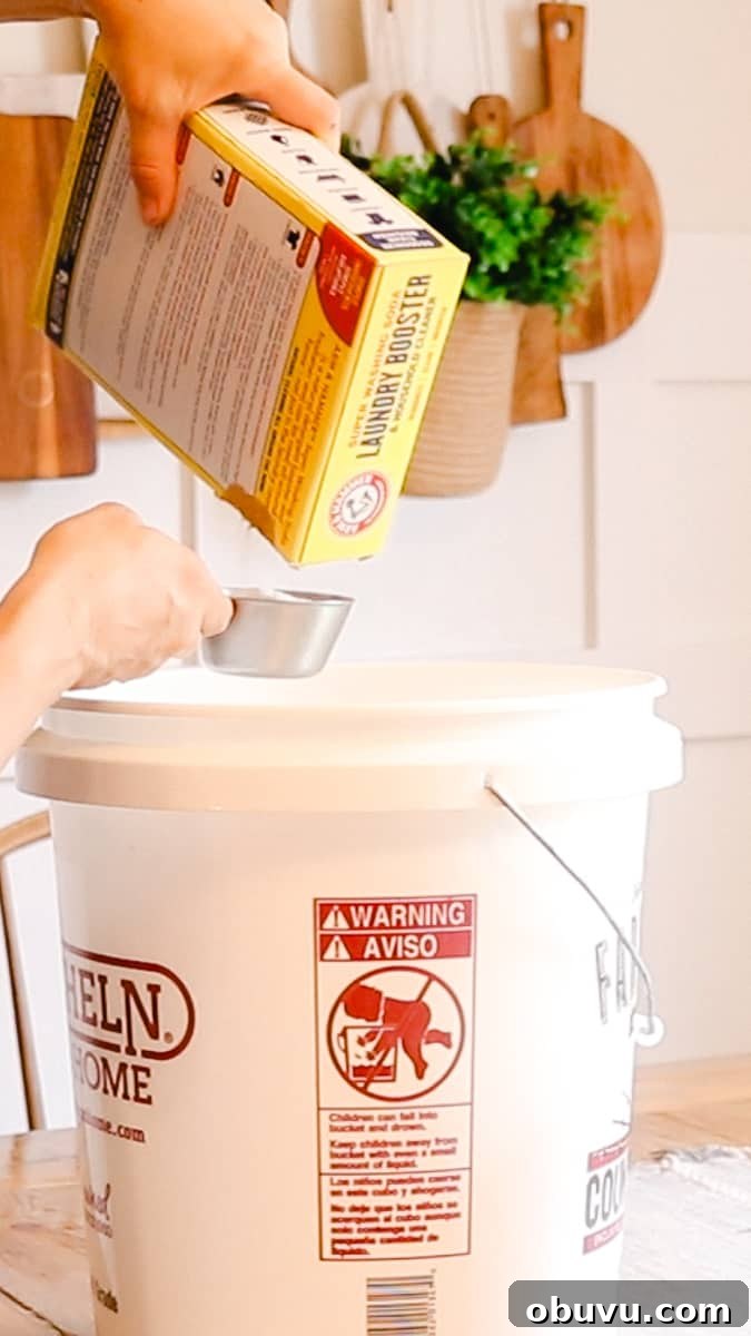 Make Your Own Laundry Soap: Simple DIY Recipe for Clean Clothes 6 Measuring out washing soda and pouring into the large bucket.